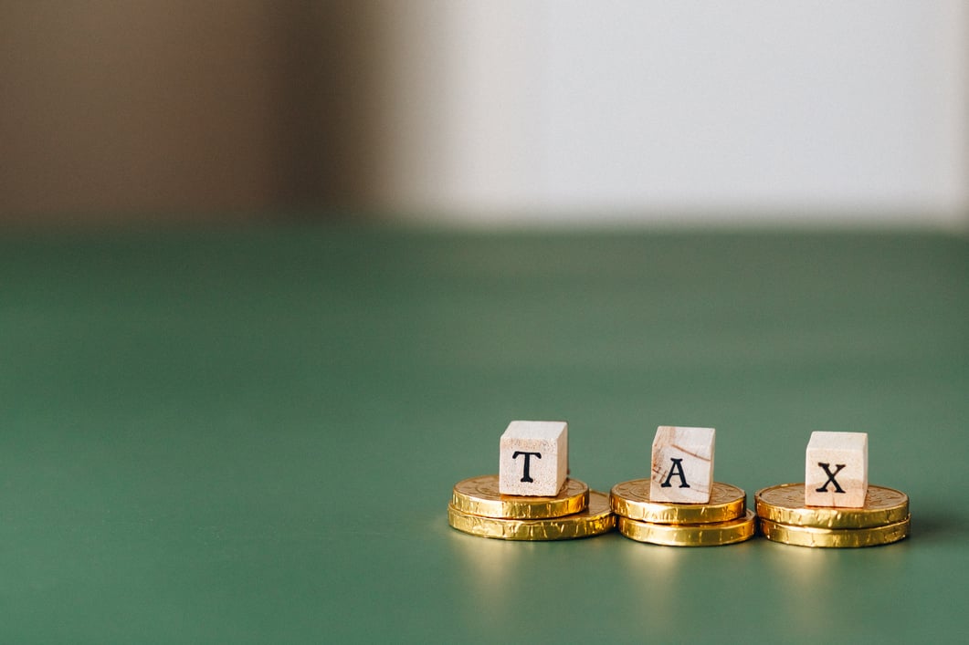 Tax Word on Top of Gold Coins